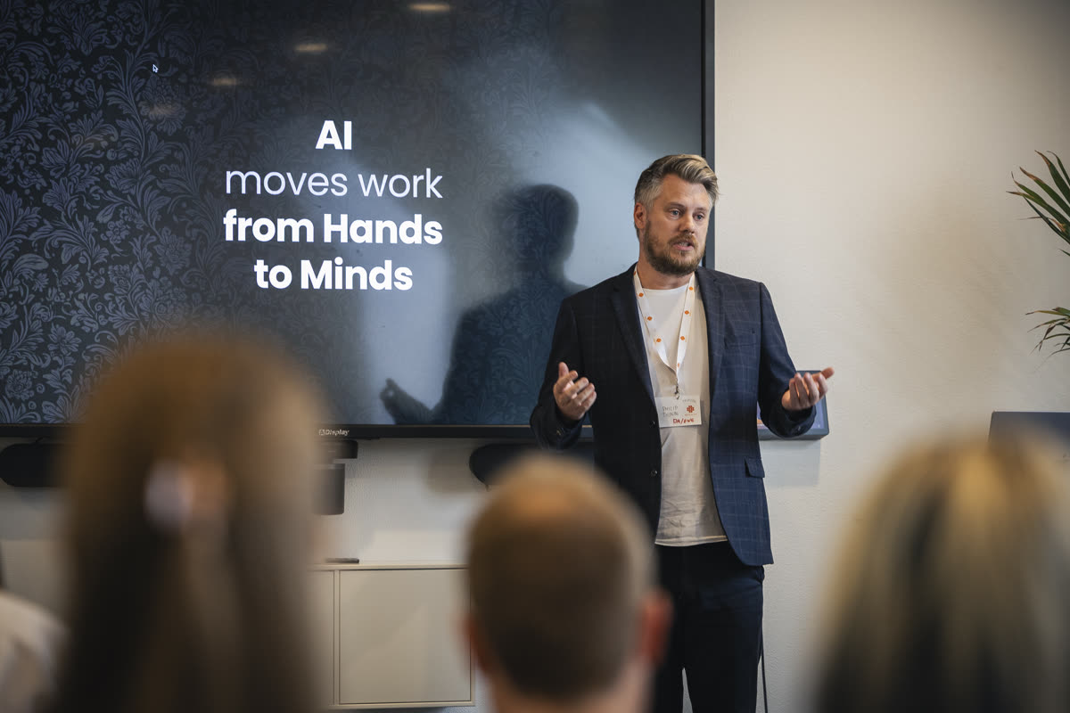Vibecoding talk at UX Connect 2025, slide reads AI moves work from Hands to Minds
